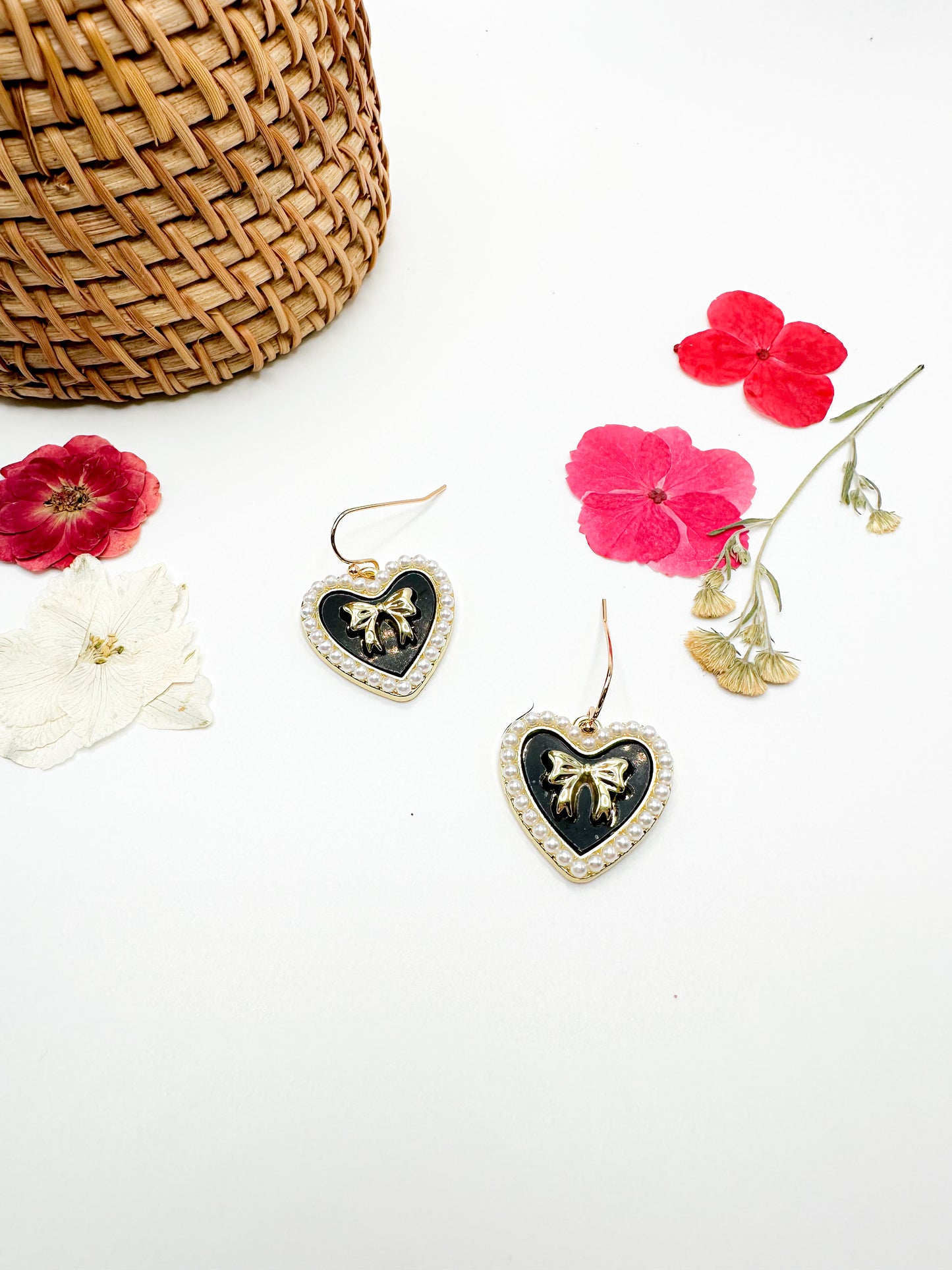 Gold heart earrings with amethyst accents