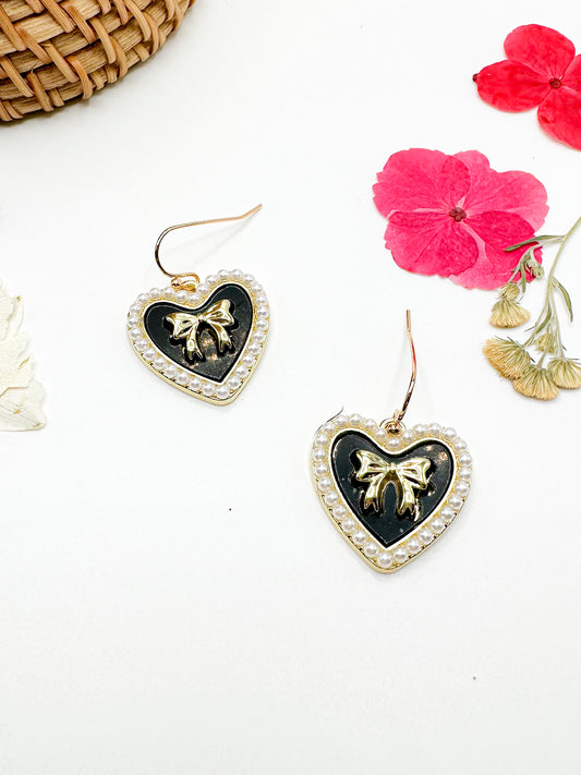 Gold heart earrings with amethyst accents