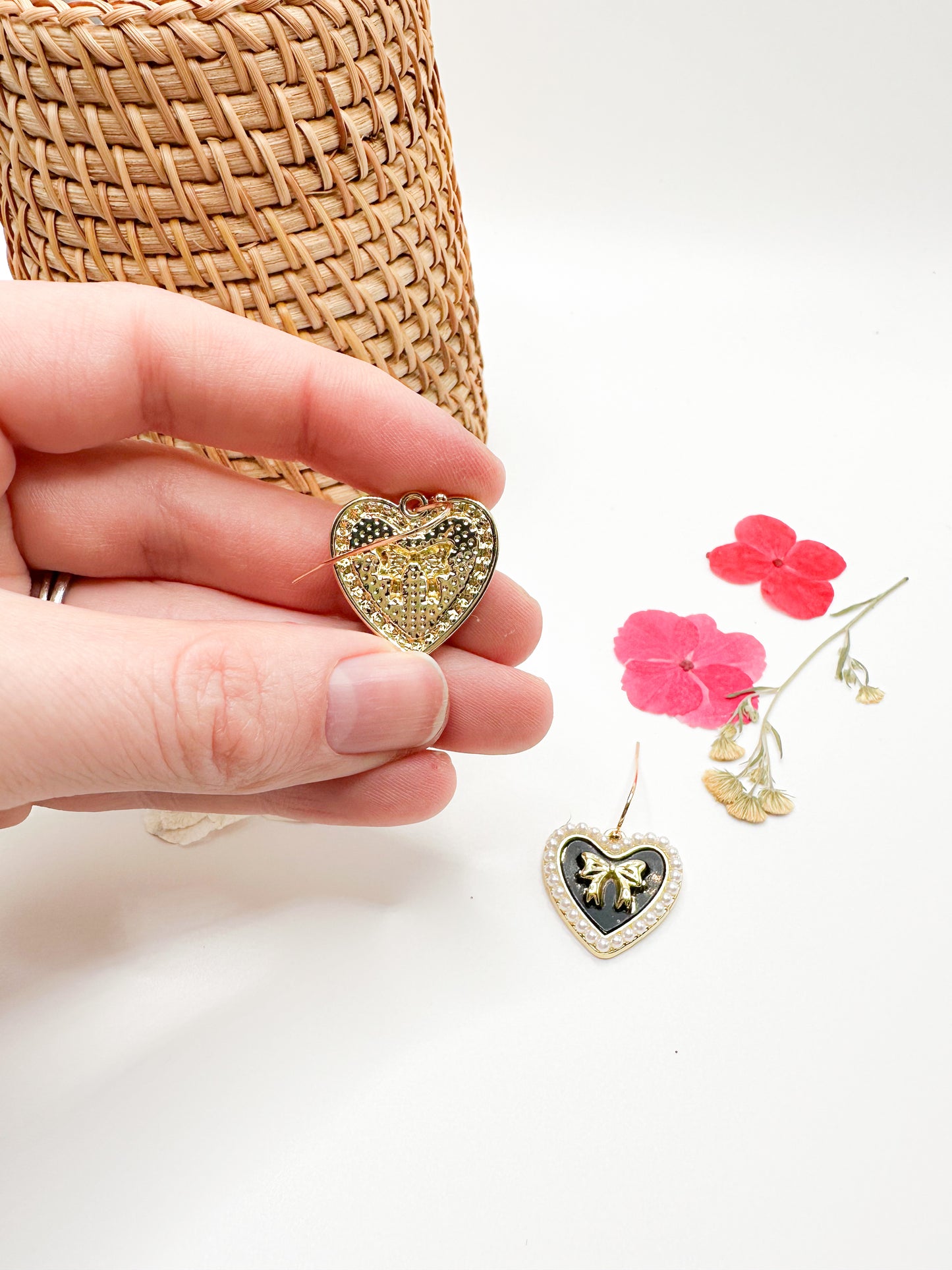 Gold heart earrings with amethyst accents