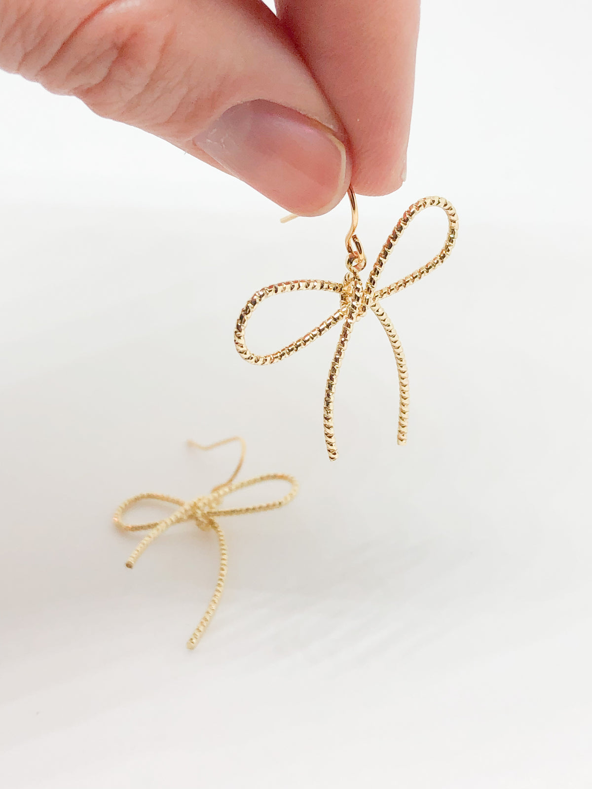 Silver bow earrings