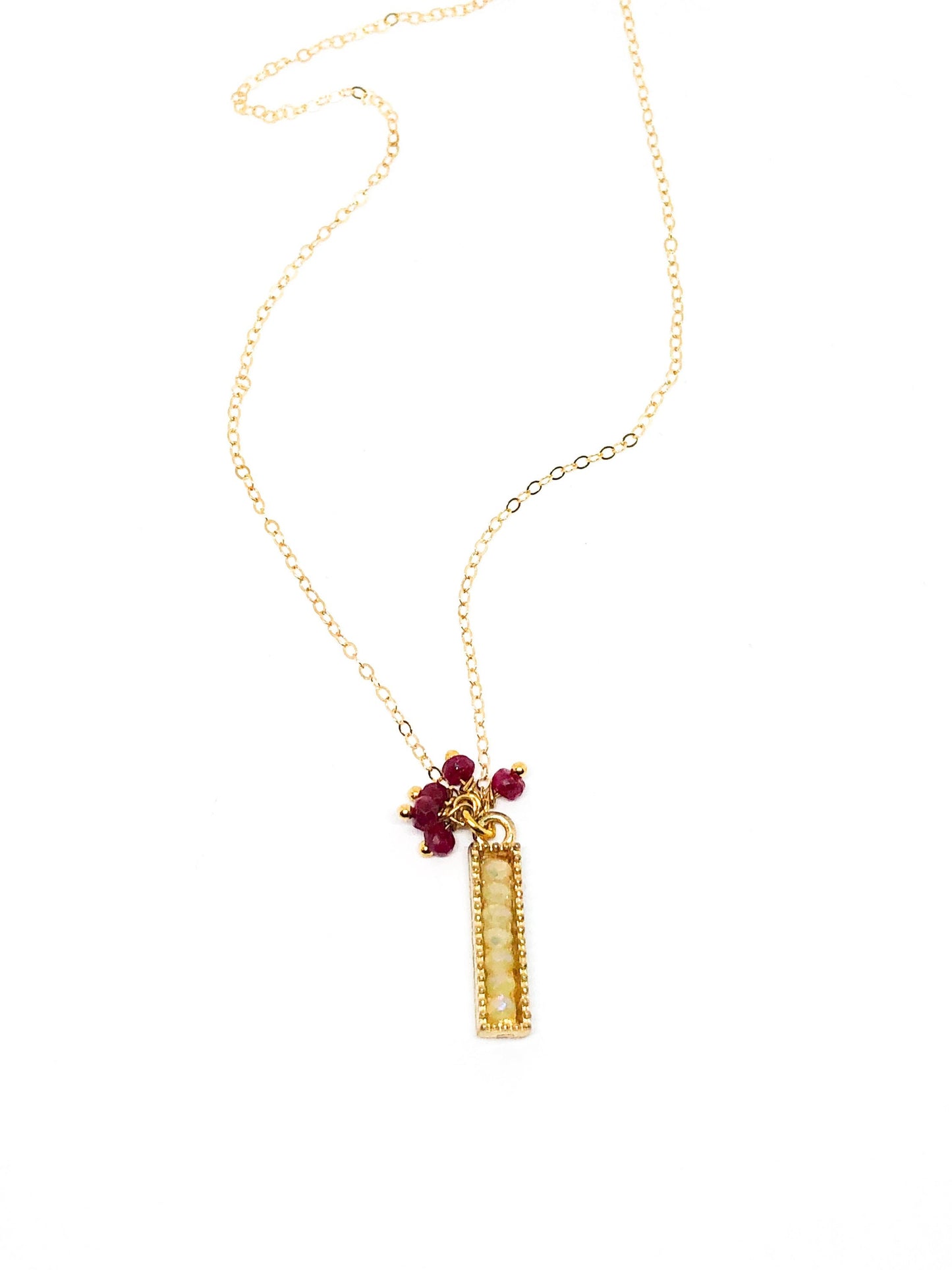 Ruby gemstone charm necklace in gold