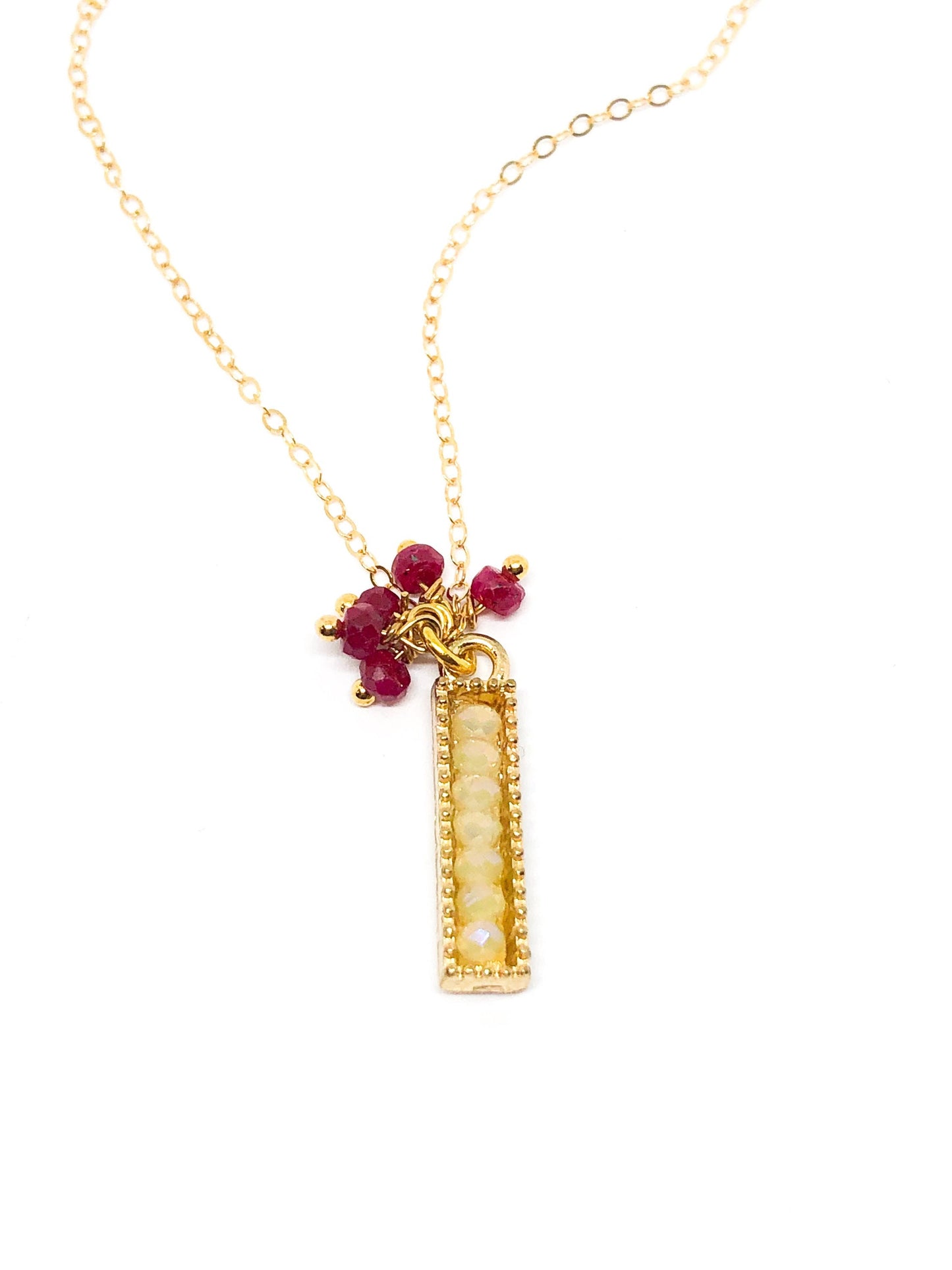 Ruby gemstone charm necklace in gold