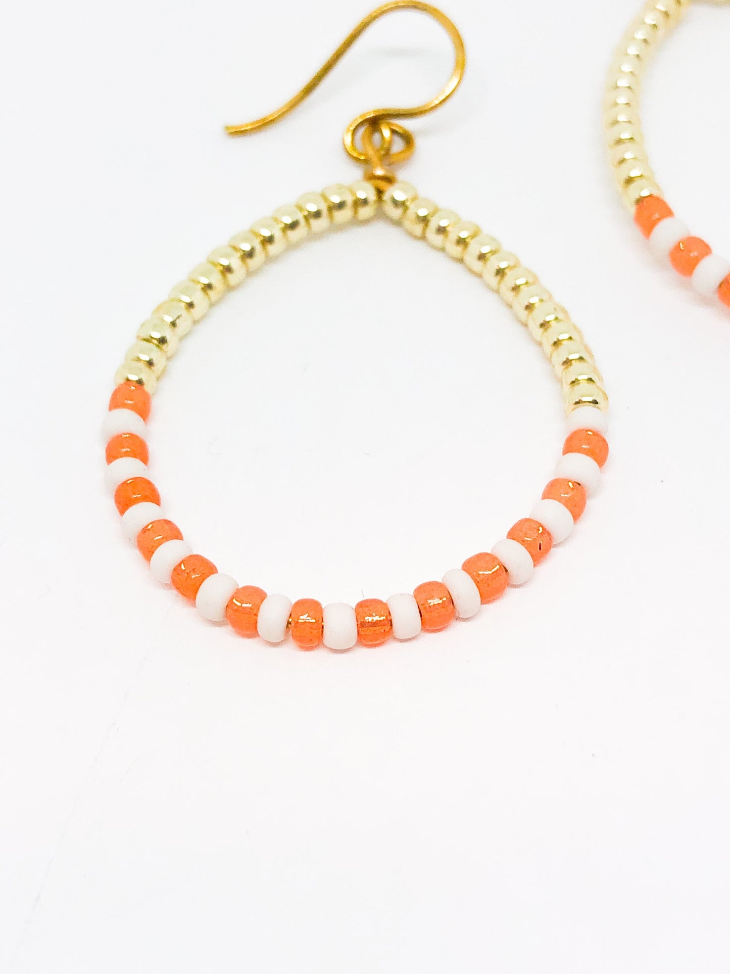 Coral and gold beaded hoop earrings