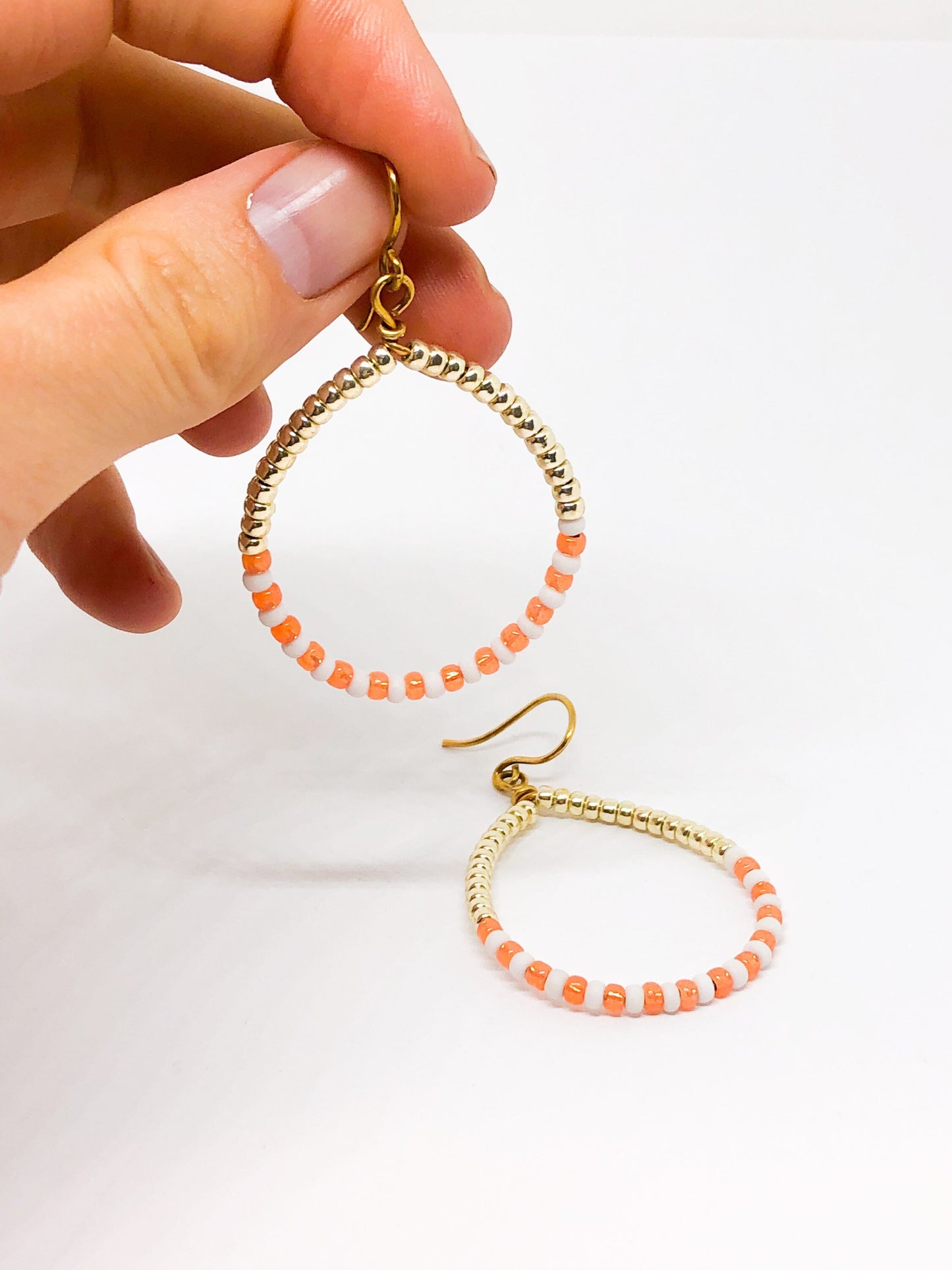 Coral and gold beaded hoop earrings