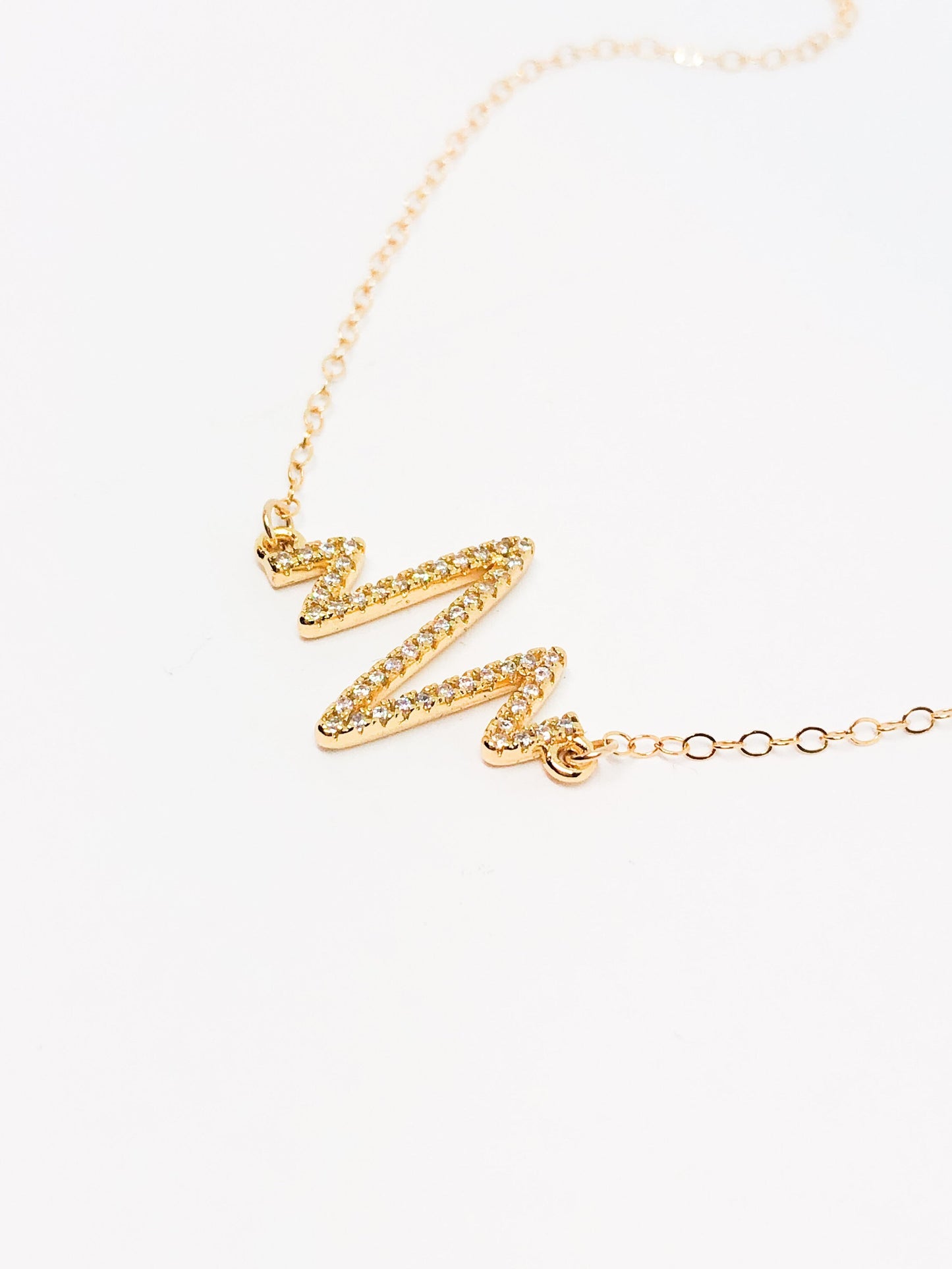 Gold heartbeat necklace