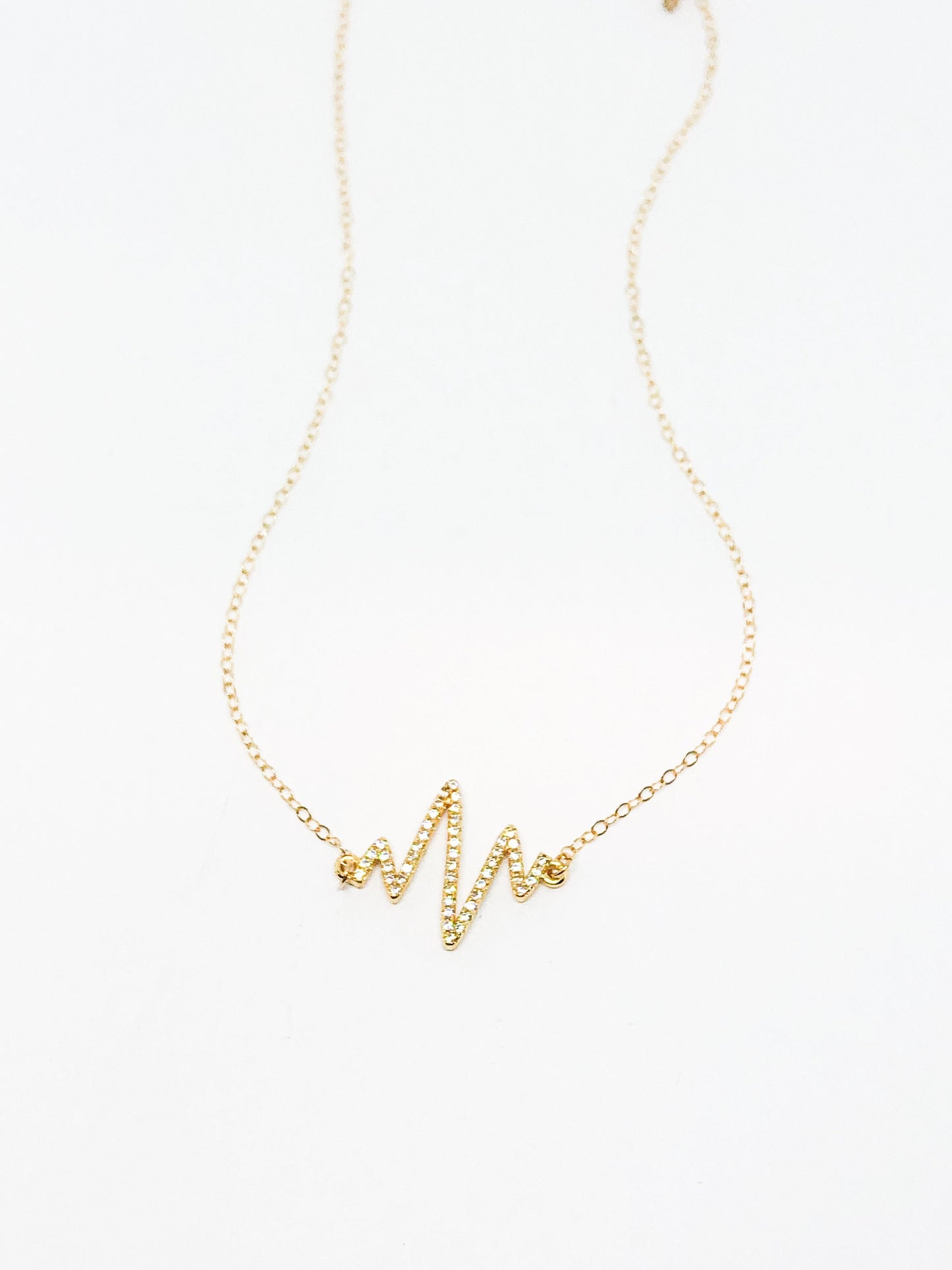Gold heartbeat necklace
