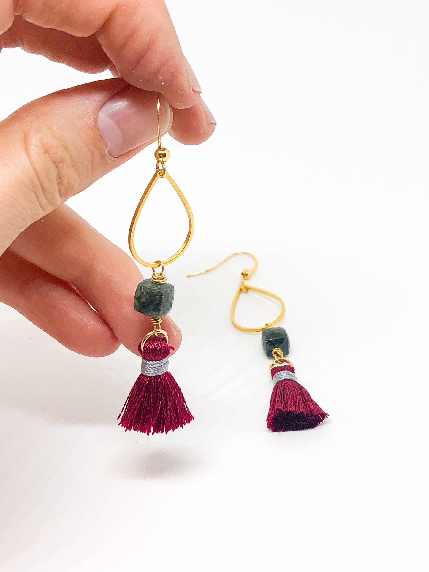Emerald earrings with red tassel