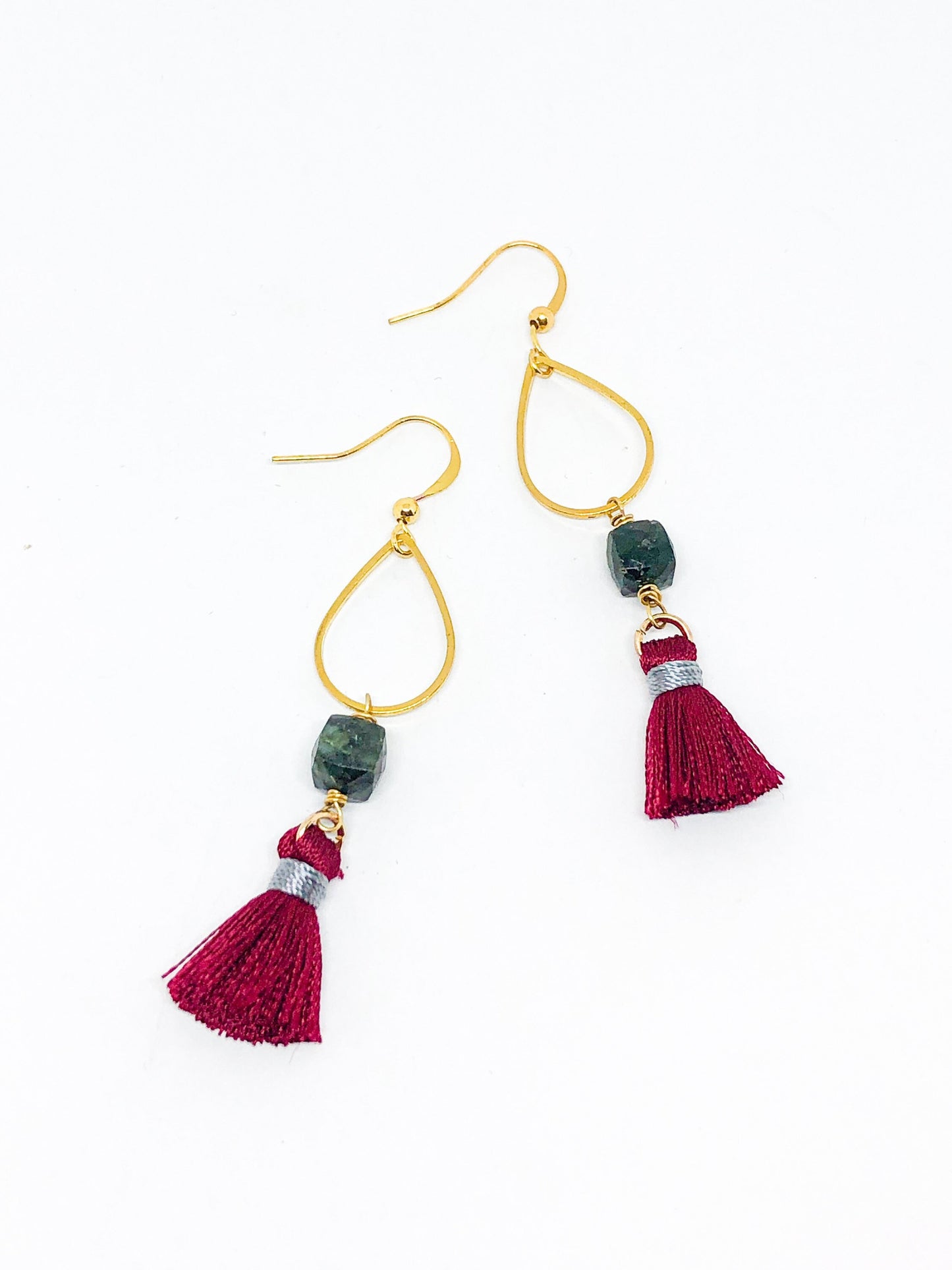 Emerald earrings with red tassel