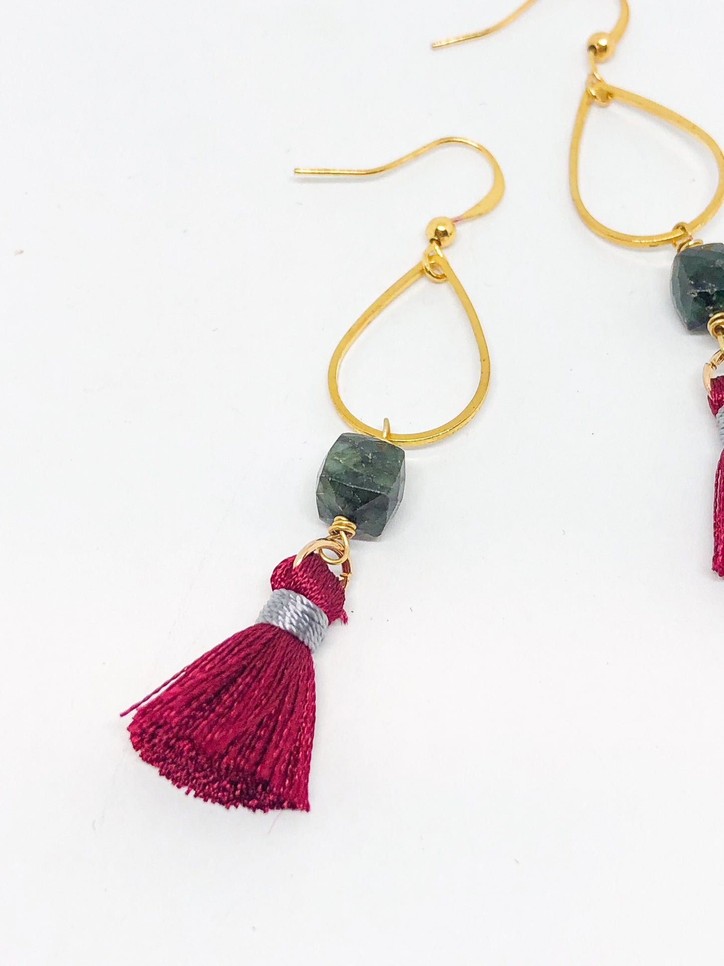 Emerald earrings with red tassel