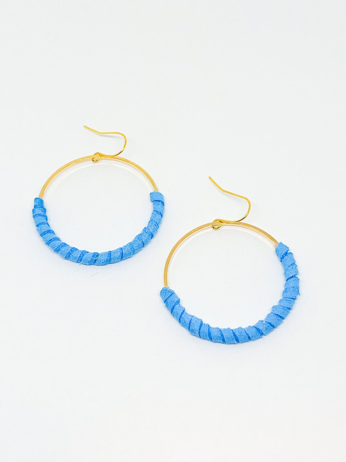 Hoop earrings wrapped in blue faux suede