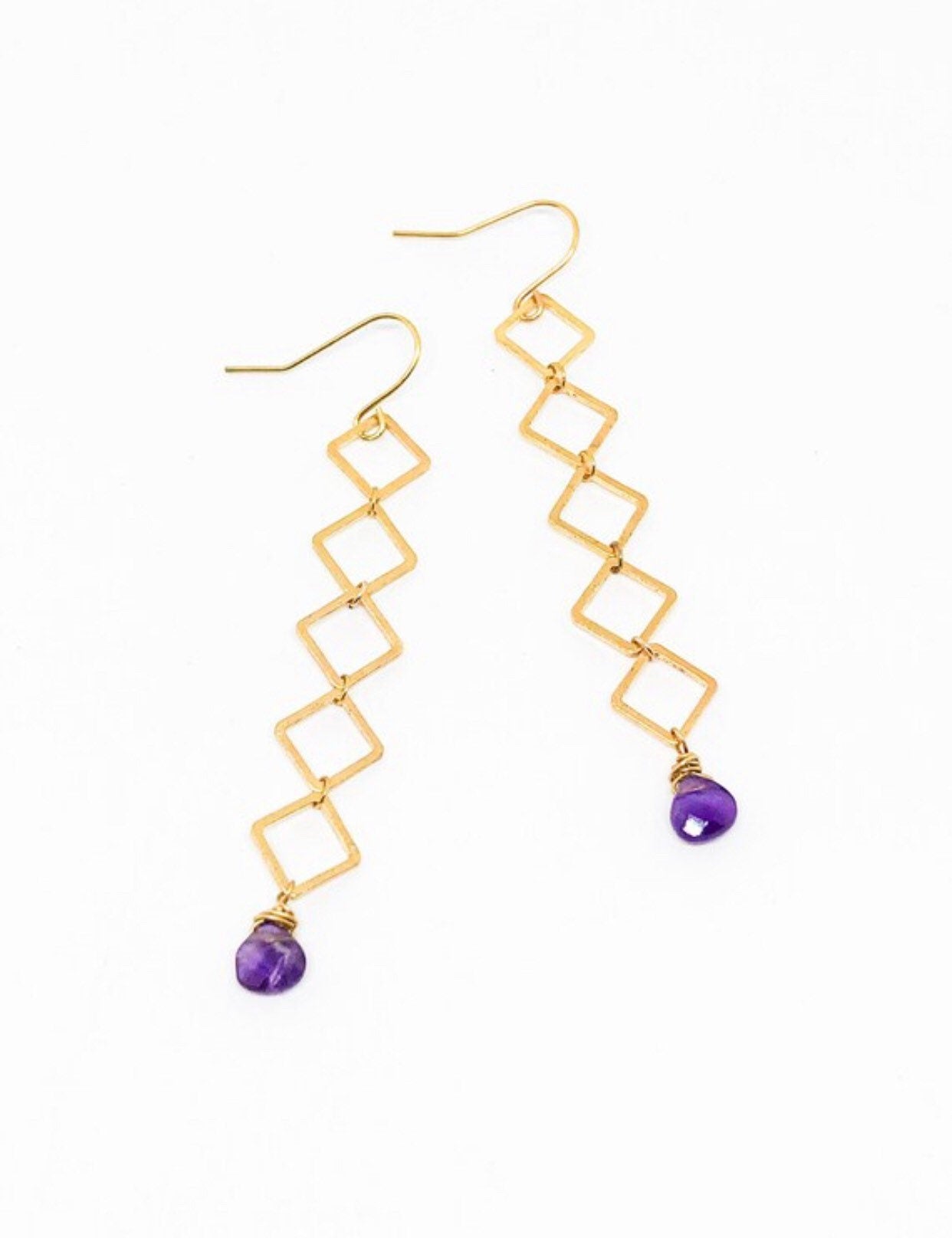 Geometric earrings dangle with cherry quartz teardrop