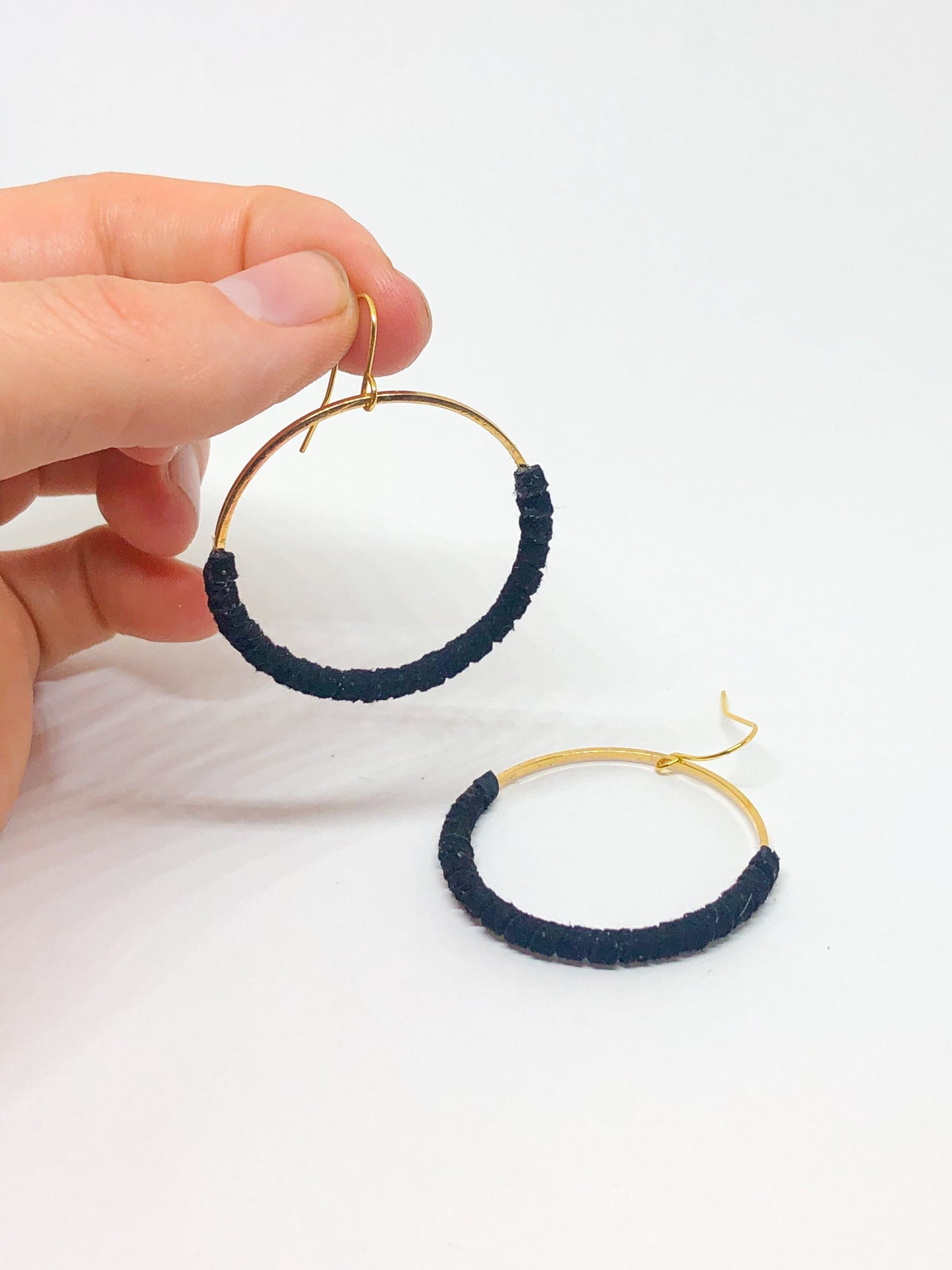 Black faux suede hoop earrings