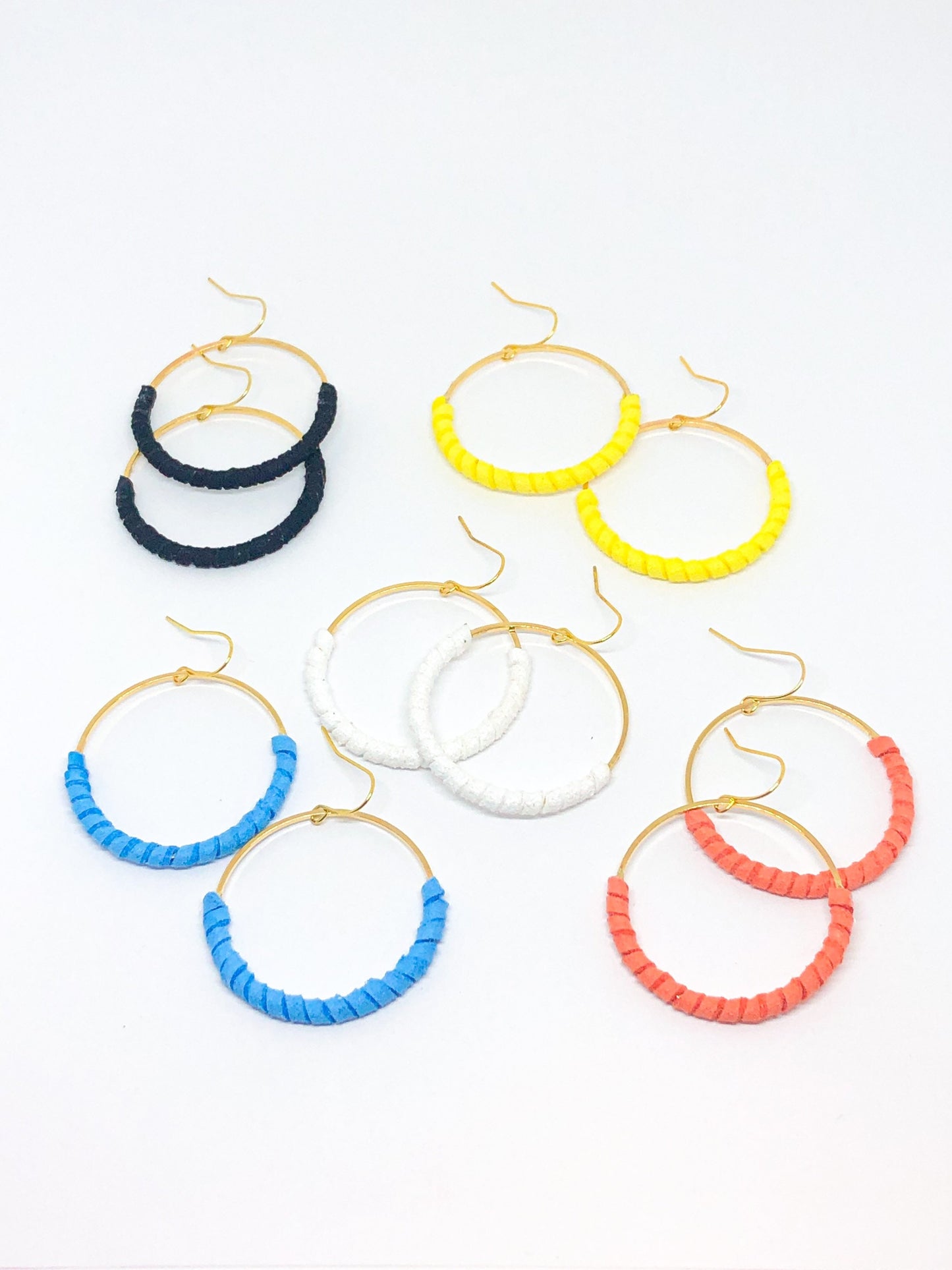 Hoop earrings wrapped in blue faux suede