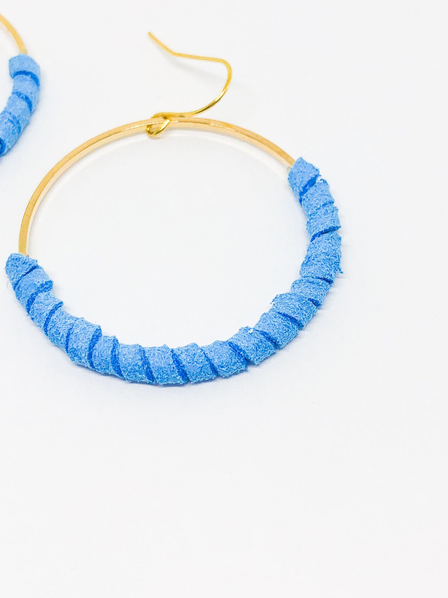 Hoop earrings wrapped in blue faux suede