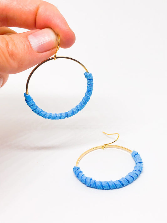 Hoop earrings wrapped in blue faux suede
