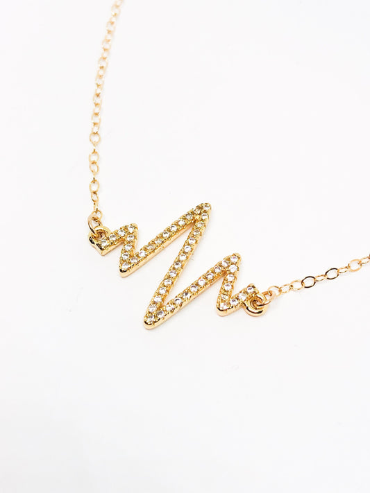 Gold heartbeat necklace