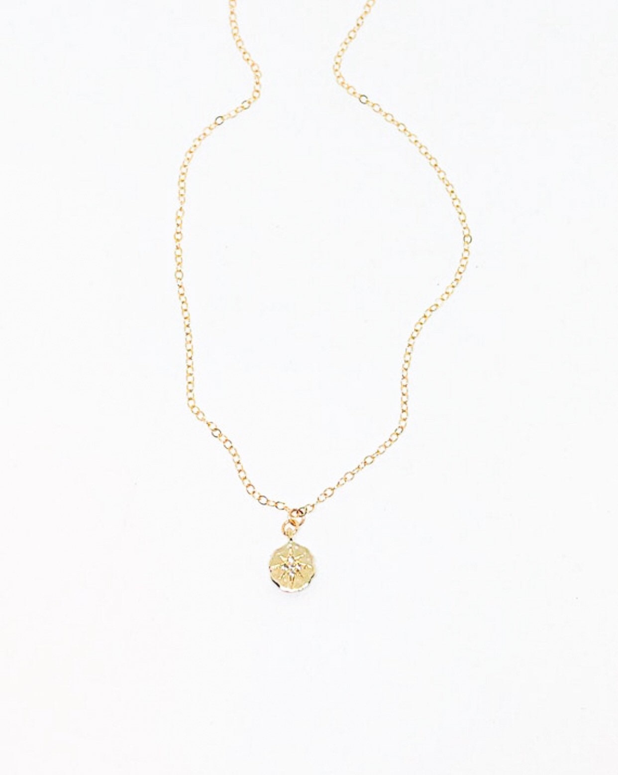 Gold starburst necklace