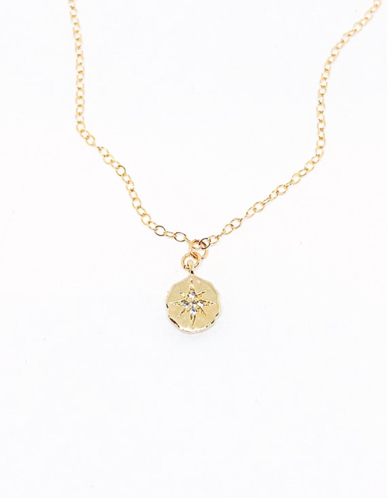 Gold starburst necklace
