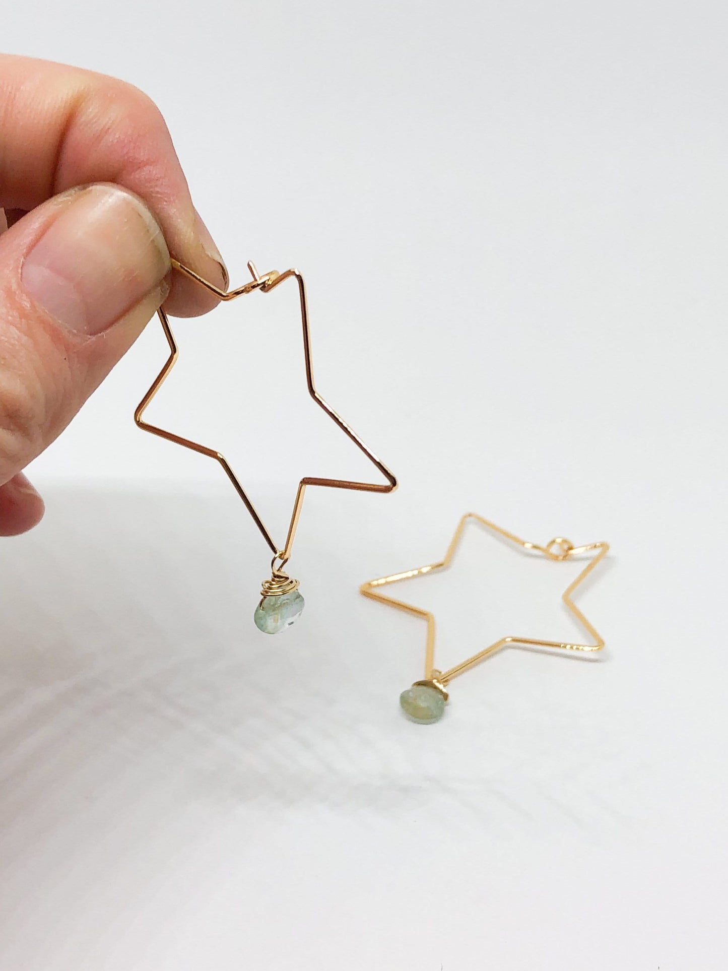 Gold star hoop earrings with aquamarine teardrop