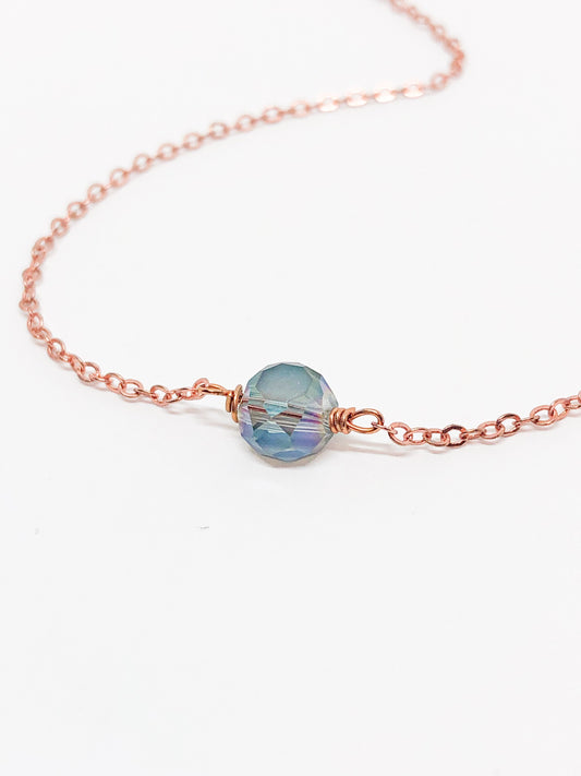 Glass bead pendant with rose gold chain
