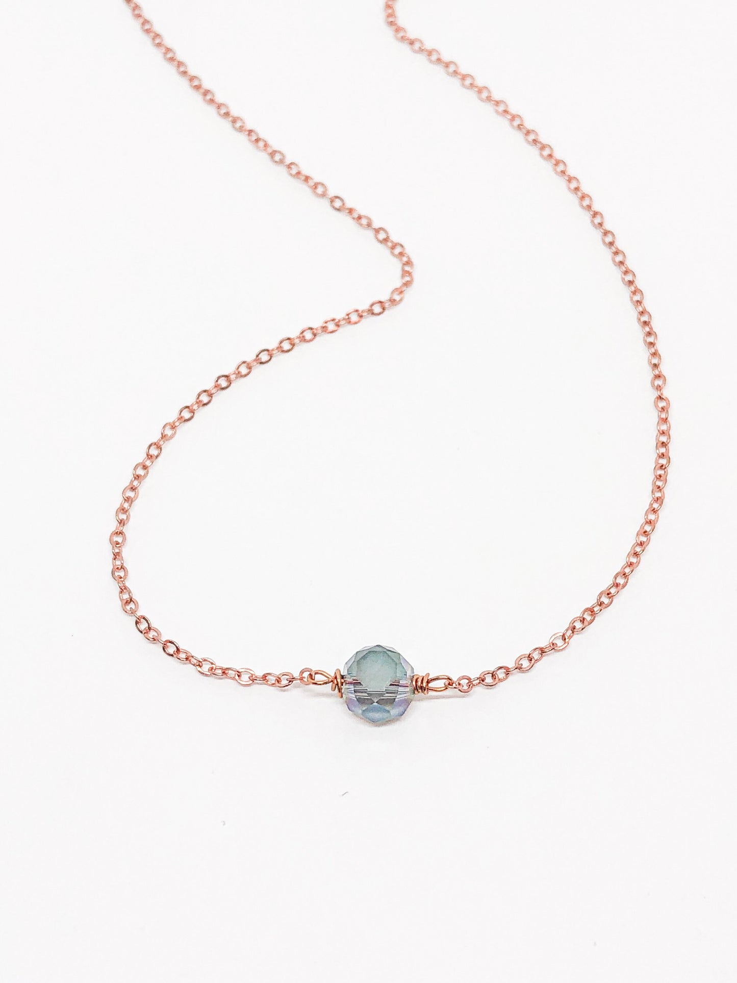 Glass bead pendant with rose gold chain