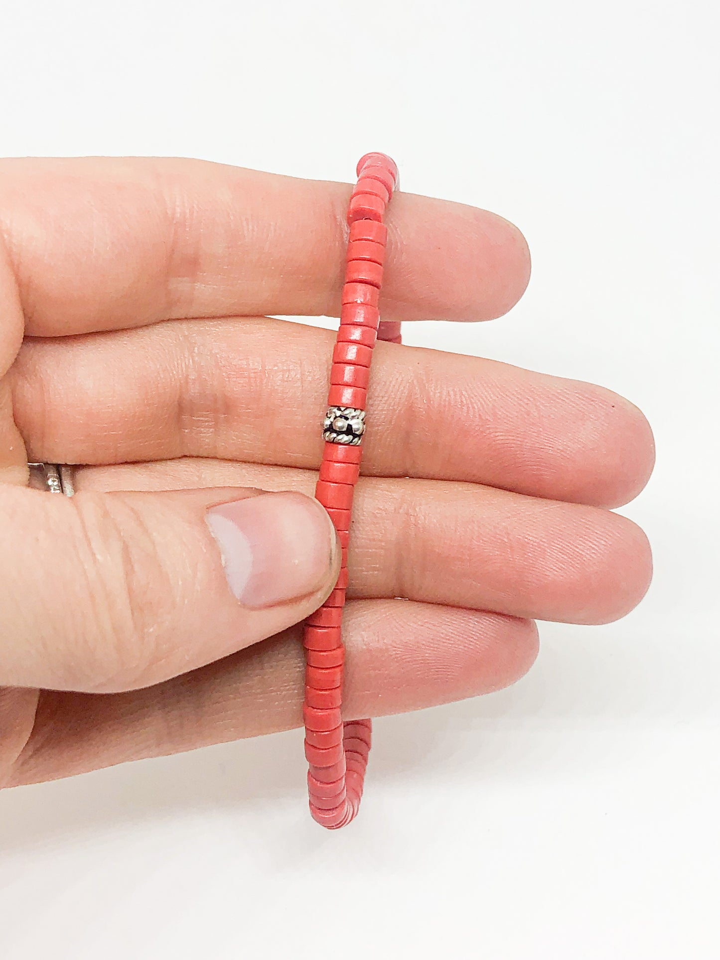 Coral beaded bracelet with silver accent