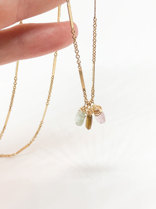 necklace in gold with aquamarine and tourmaline accents